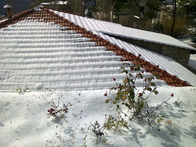 snow covered tile roof