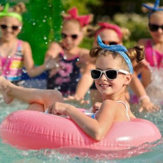 girls splashing in the pool