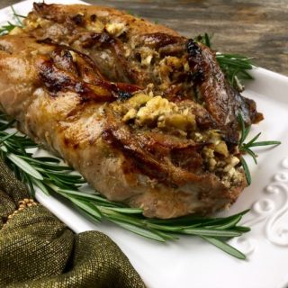 Roast pork tenderloin stuffed with dates, apples, and feta