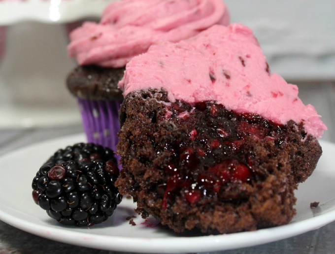 Chocolate blackberry cupcakes on white plate