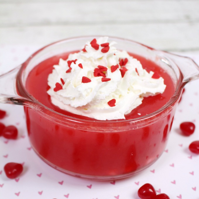 Red Hot Applesauce Jello in glass dish on table. 