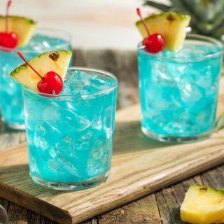 Refreshing Blue Hawaii Cocktail Punch with Pineapple and Cherry
