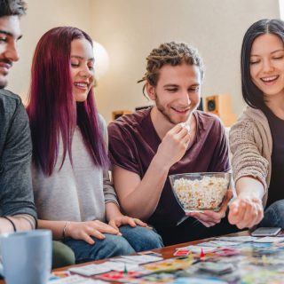 Young adults playing board games