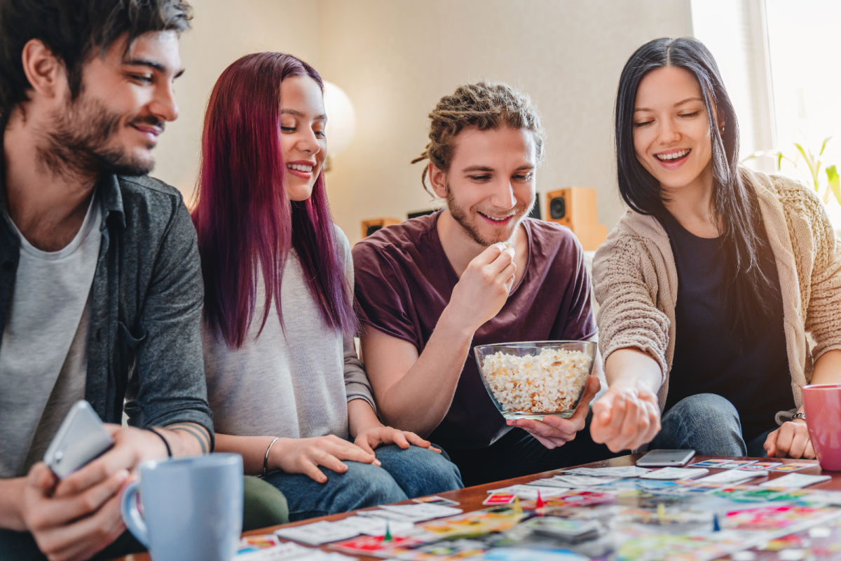 Young adults playing board games