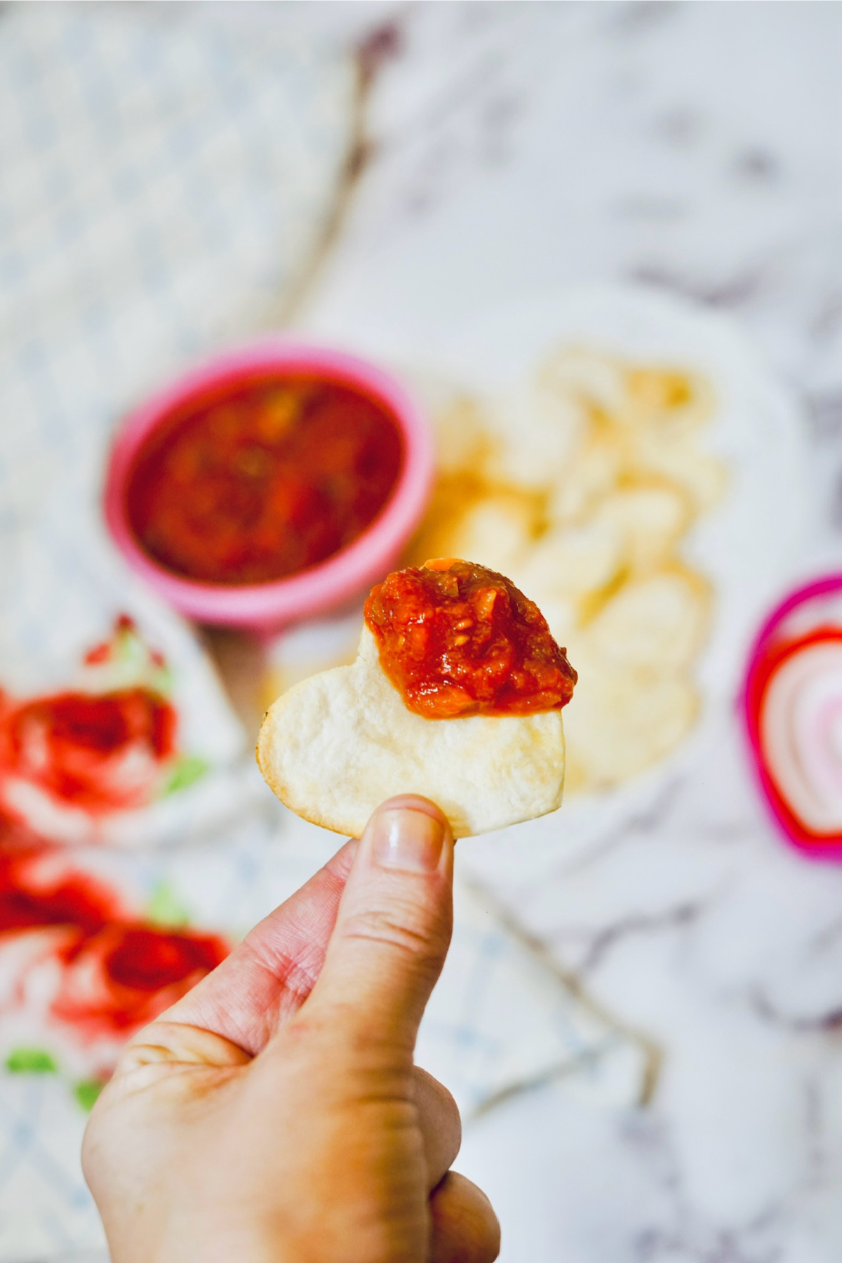 heart tortilla chip with salsa