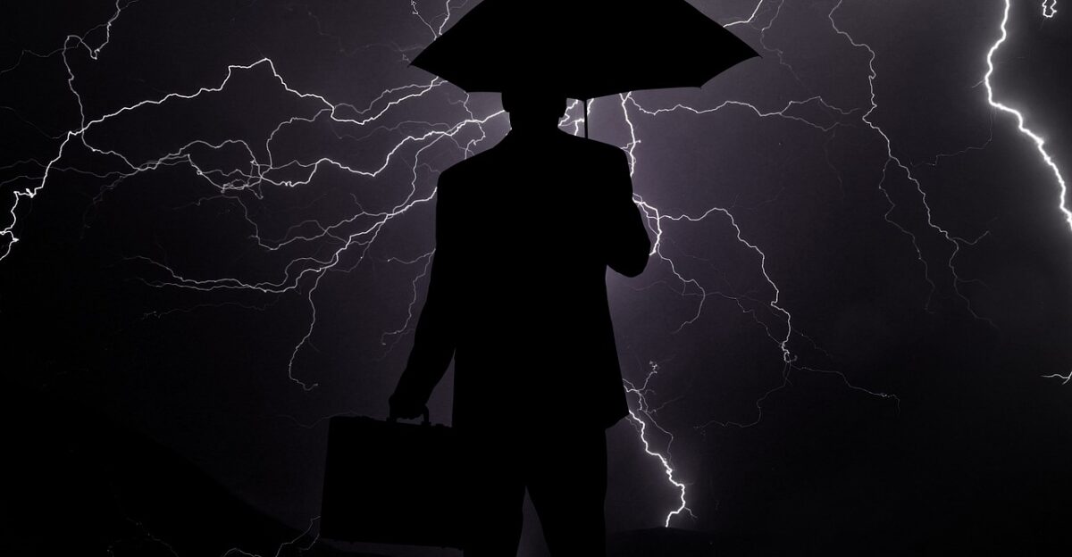 businessman crisis rain lightning baisse business umbrella economic decline economic downturn recession low point low loss stagnation nature stop quiet time slackened economic crisis people darkness silhouette