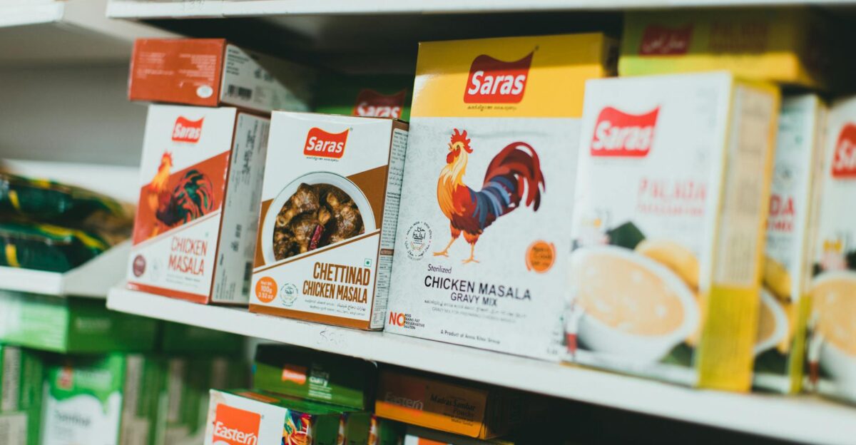 Assortment of Indian spice mixes on a grocery store shelf featuring colorful packaging