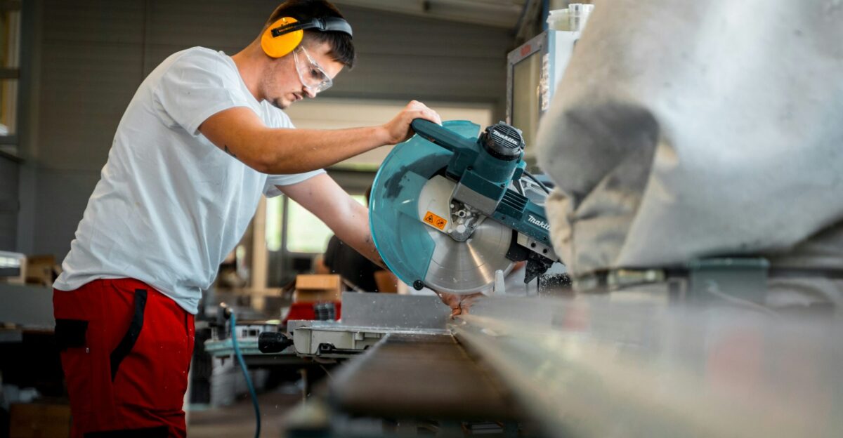 A man working on a machine in a factory