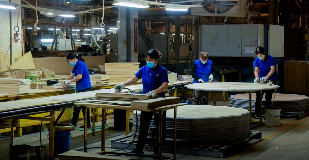 A group of people working in a factory