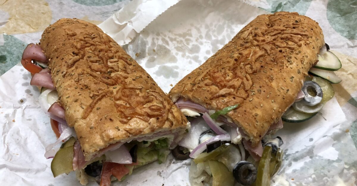 A black forest ham foot-long sandwich from Subway with American cheese black olives cucumbers lettuce pickles tomatoes red onions regular mayonnaise oil red wine vinegar in the Franklin Farm section of Oak Hill Fairfax County Virginia