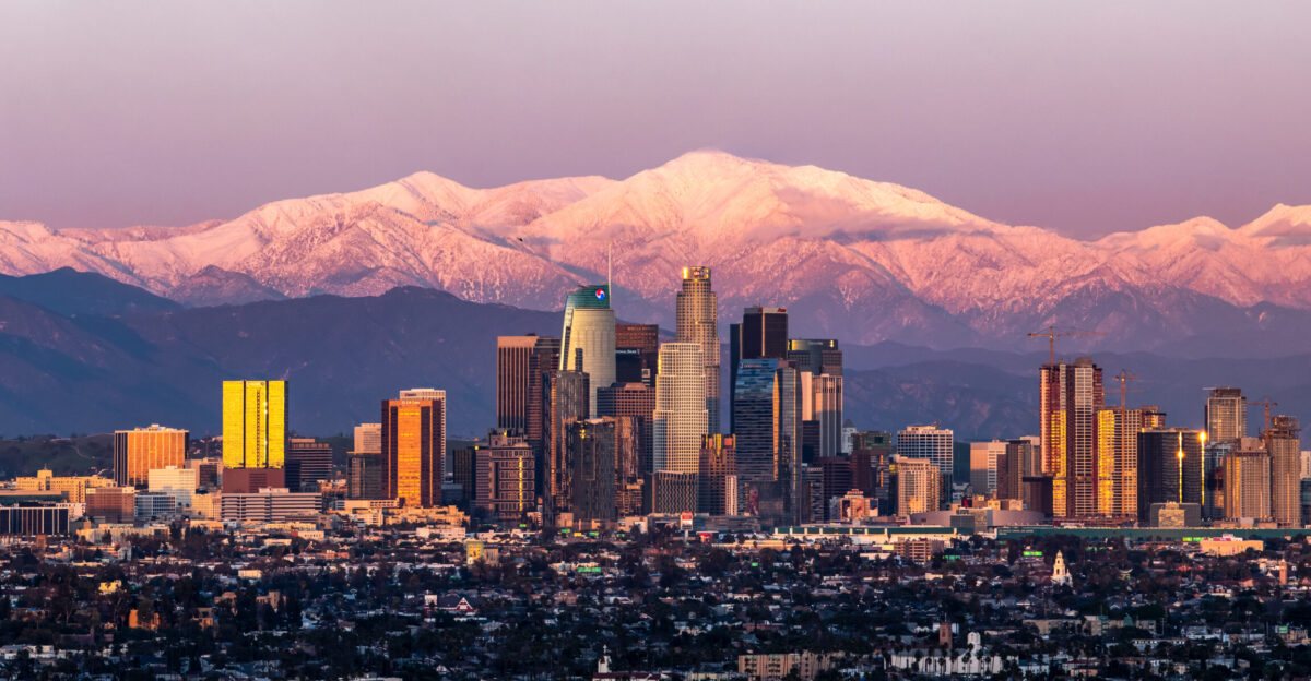February shot of downtown Los Angeles sunset with Mount Baldy in the background after a large snow storm