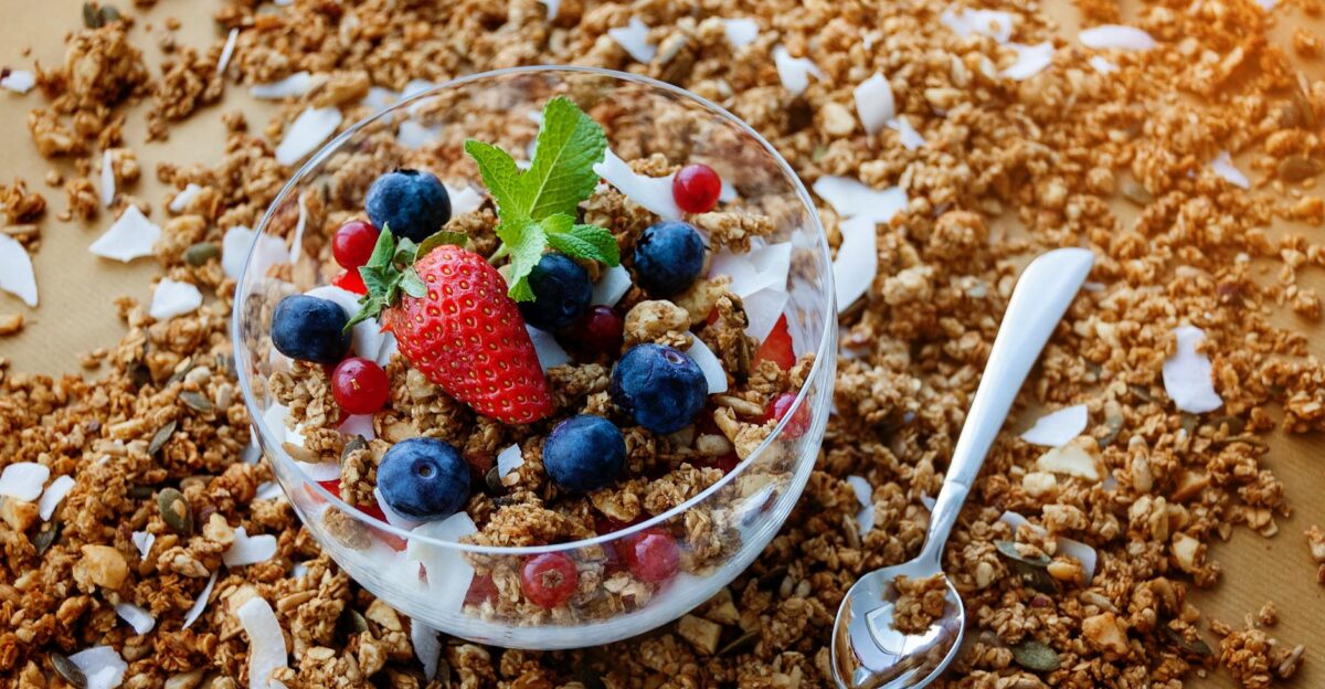 A top view of a healthy granola breakfast with fresh berries and yogurt in Bucure ti