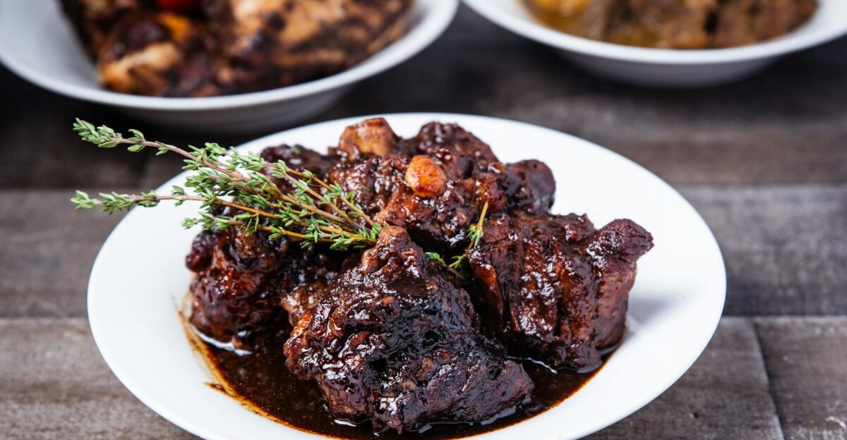 Delicious braised oxtail served with herbs in a rich sauce perfect for a gourmet meal