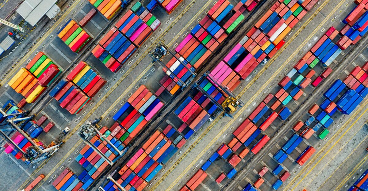 Aerial view of vibrant shipping containers at a busy Jakarta port showcasing global trade