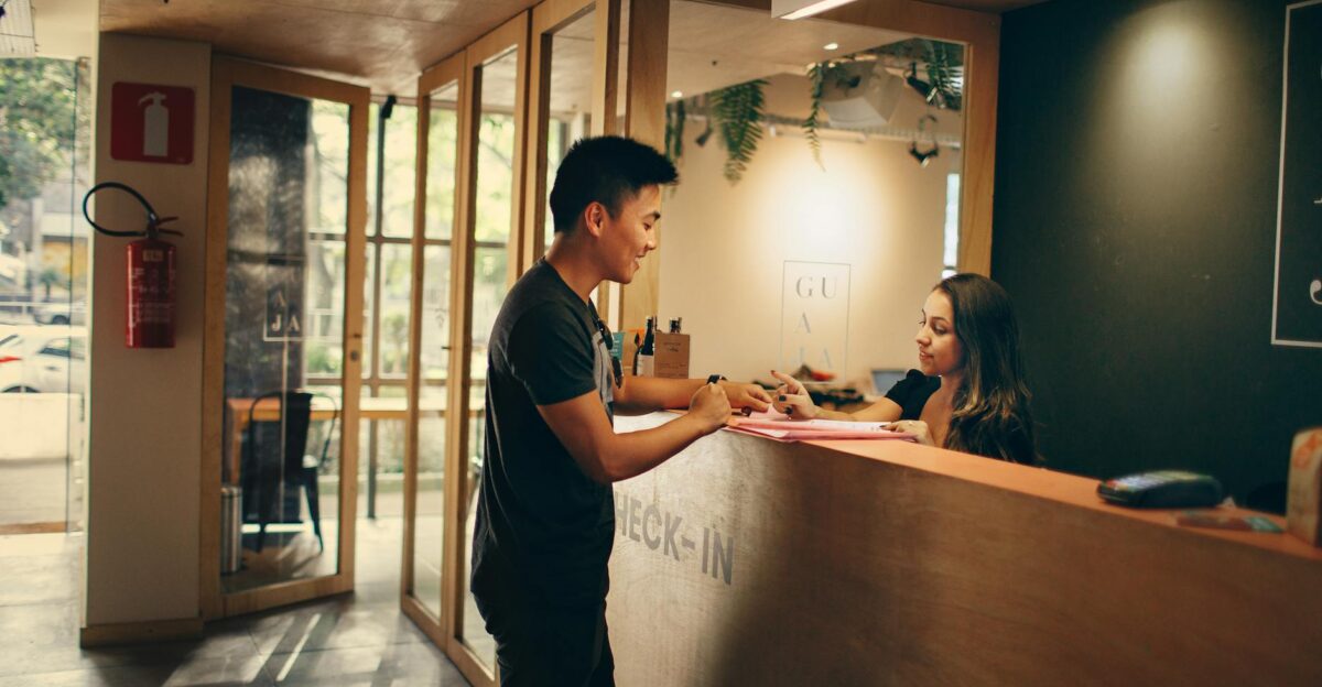 A customer checks in at a hotel reception desk in Belo Horizonte Brazil