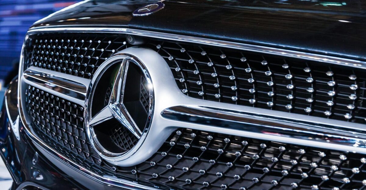Detailed view of the iconic Mercedes Benz emblem showcasing luxury and design excellence