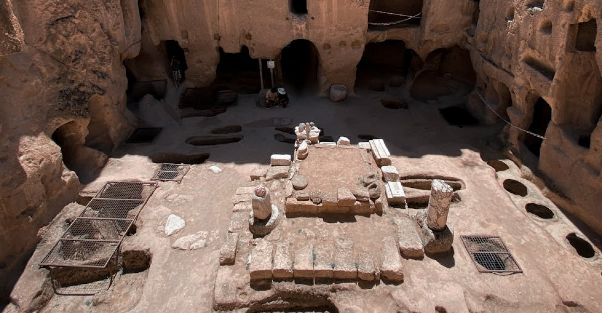 Explore the majestic ruins of an ancient underground cave dwelling with intricate rock formations