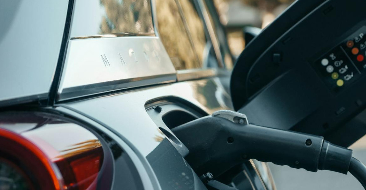 Close-up of an electric vehicle being charged highlighting modern clean energy technology