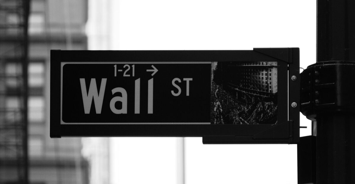 grayscale photo of Wall St signage