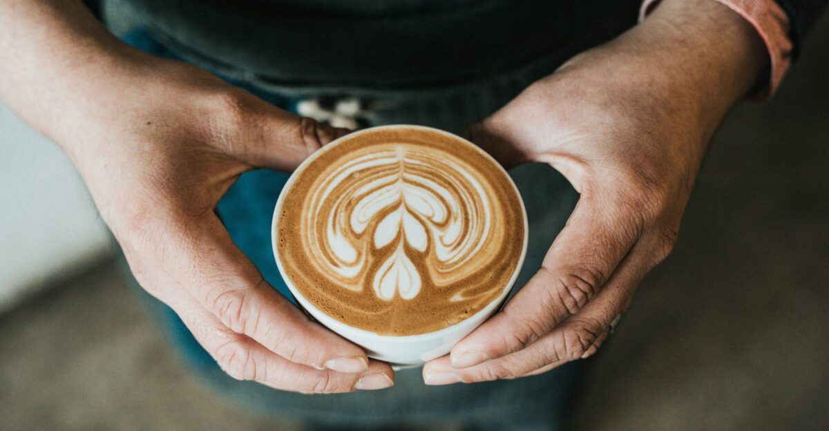 focus photography of coffee artwork