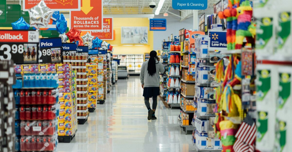 person standing between shelvings
