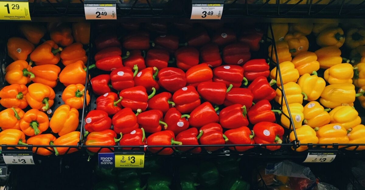 pile of bell peppers and beans at the grocery