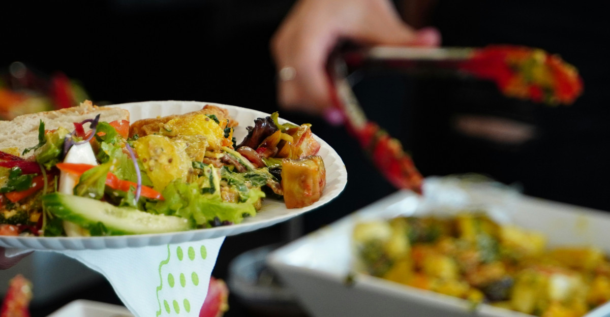 person holding white ceramic bowl with food