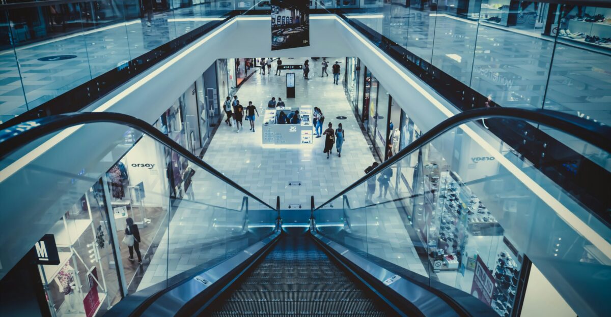 people walking on black and white escalator