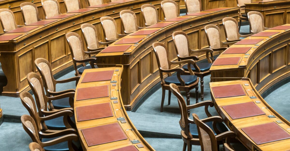 brown wooden chairs on blue and brown wooden floor