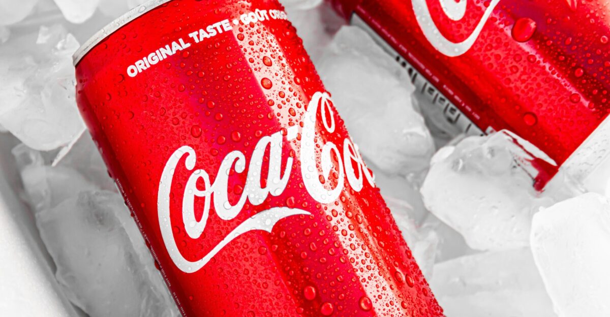 coca cola can on white plastic pack