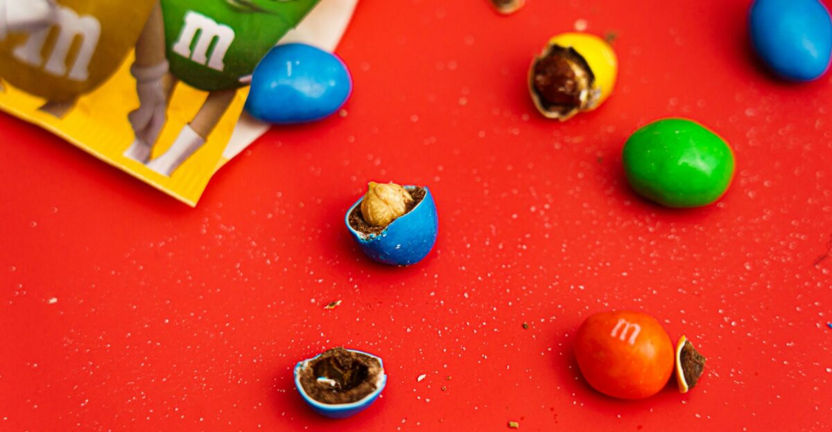 a red table topped with lots of candy