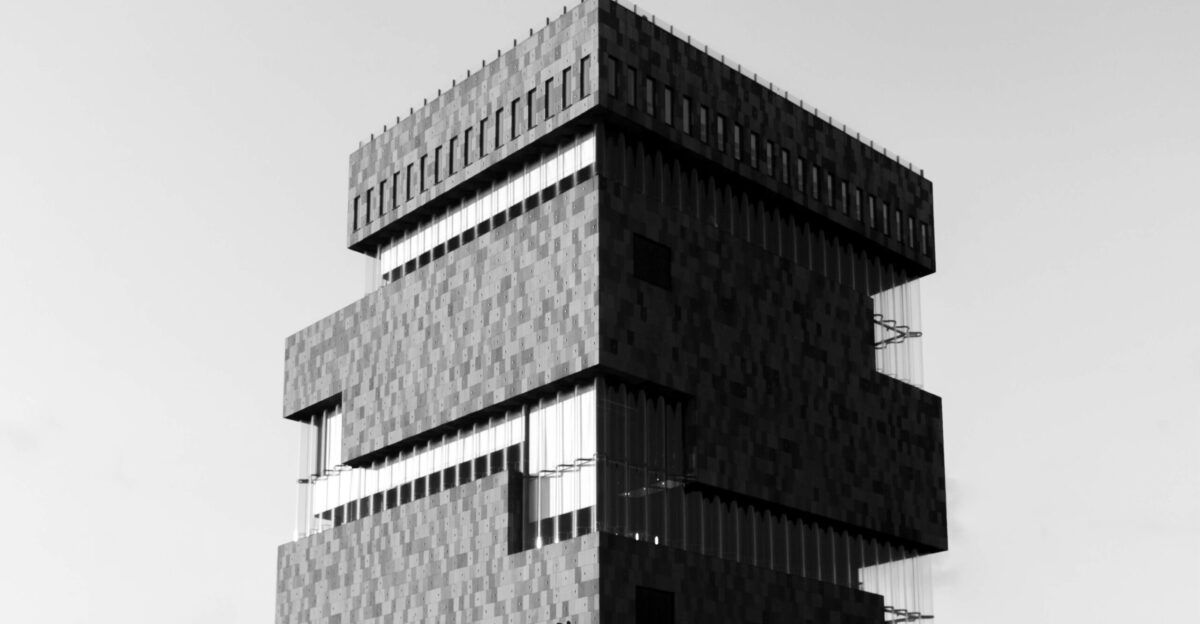 a black and white photo of a tall building