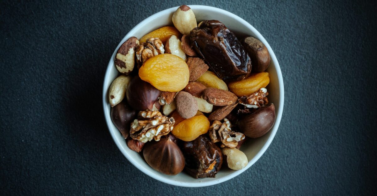 a white bowl filled with nuts on top of a table