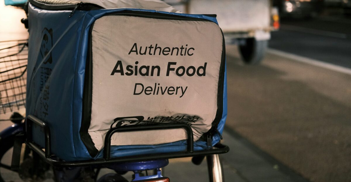 a blue and white bag on the back of a bike
