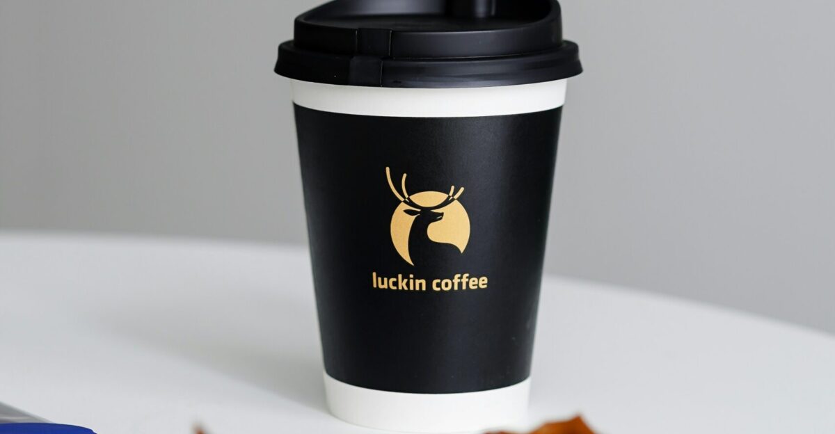 a cup of coffee sitting on top of a white table