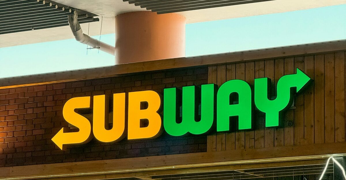 a subway sign above a subway entrance