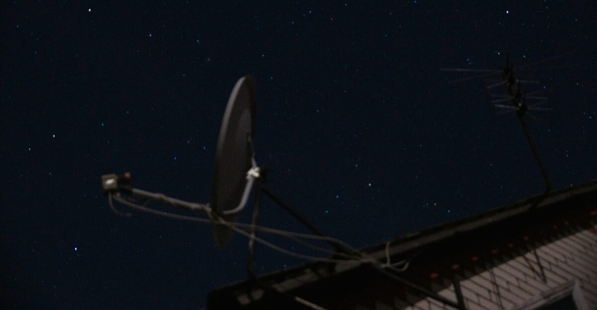 A satellite dish sitting on top of a roof